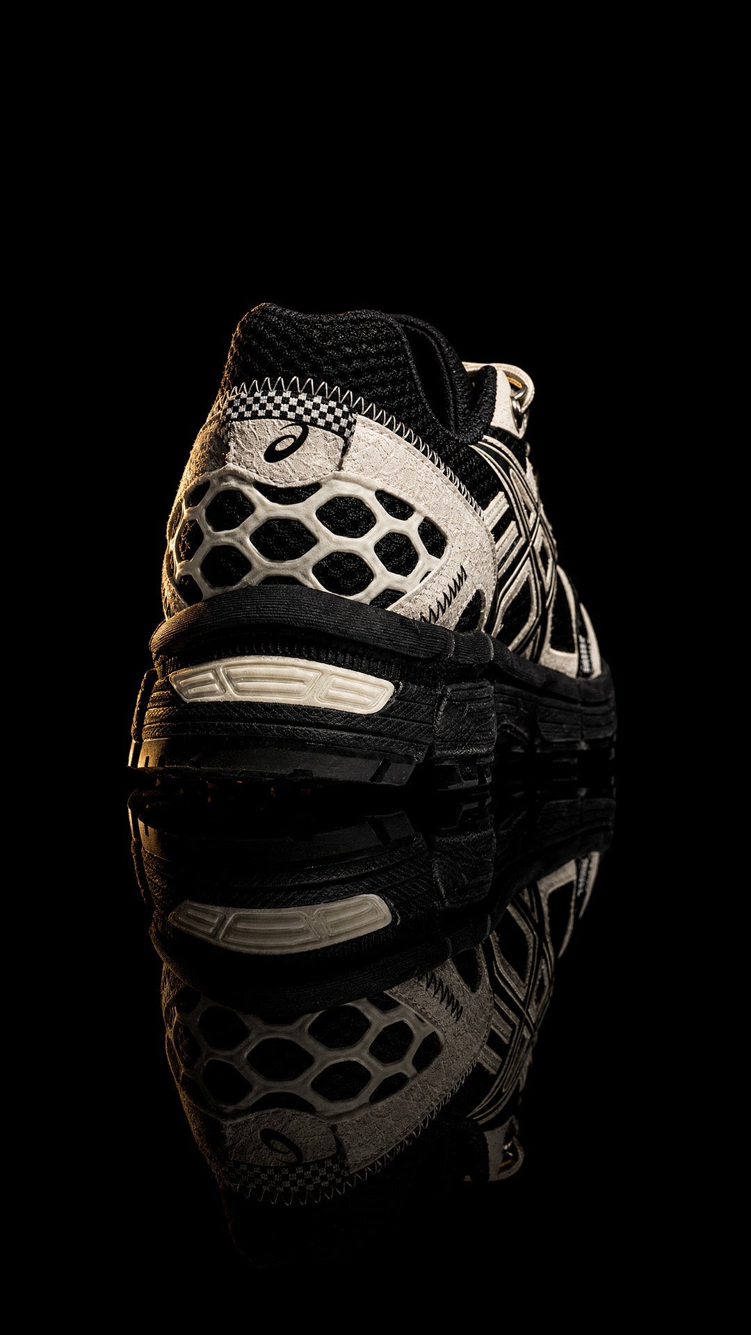 ASICS Gel-Kahana 8 'Black Cream' photographed on black with reflection